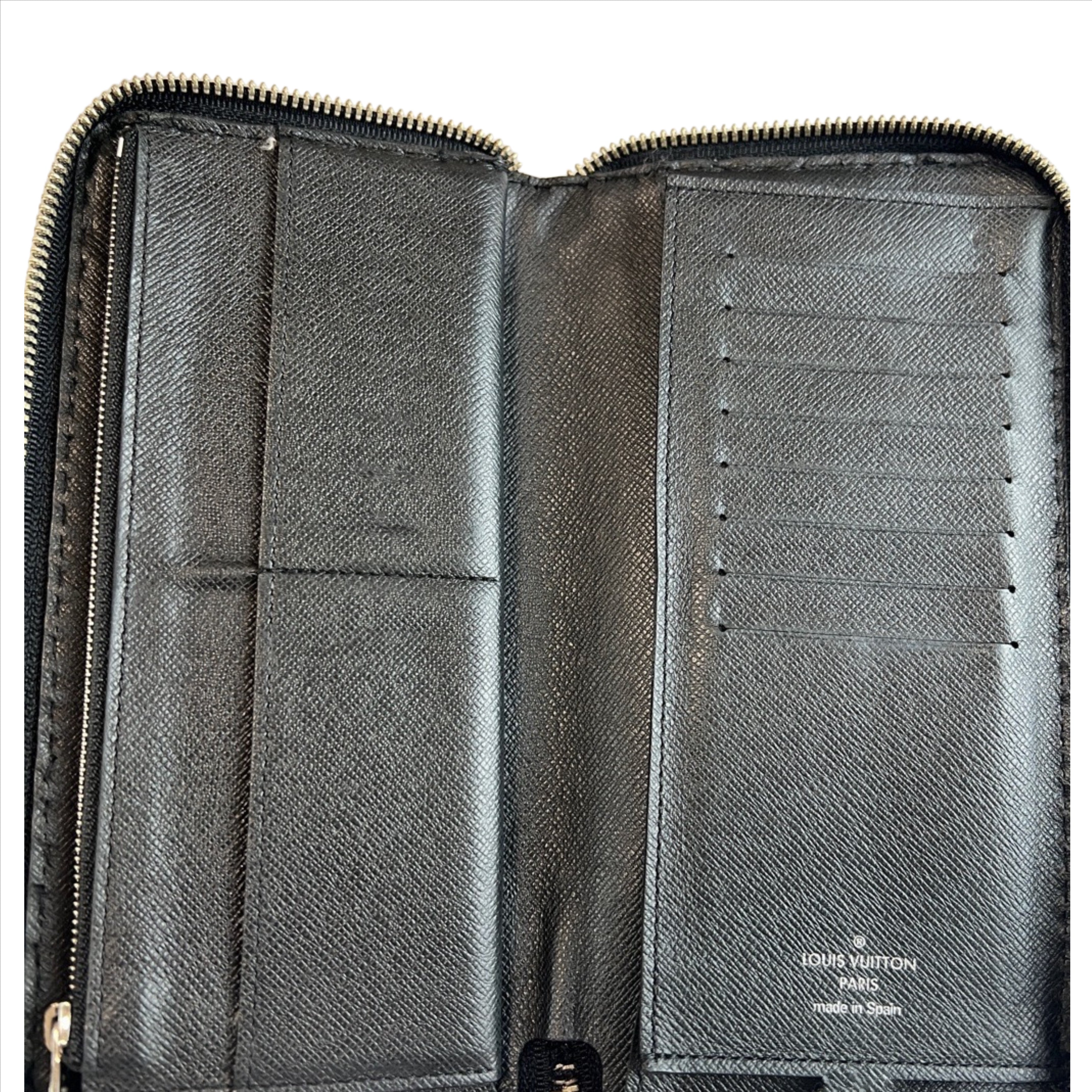 LOUIS VUITTON Taiga Vertical Zippy Wallet Black